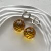 Серебряные серьги шары с граненым прозрачным янтарем