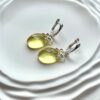 Серебряные серьги бантики с граненым прозрачным янтарем
