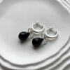 Серебряные серьги бантики с граненым янтарем