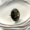 Серебряное кольцо с темным зеленым янтарем с лимонными вкраплениями